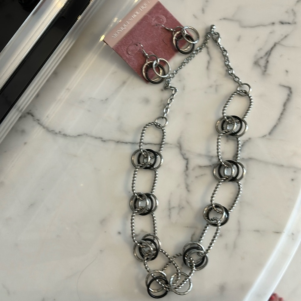 Two piece earrings and necklace set. Silver and black.